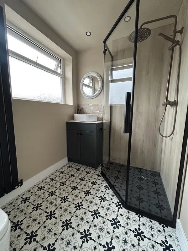 Fully tiled walk-in shower room with large format porcelain tiles fitted in Blackpool