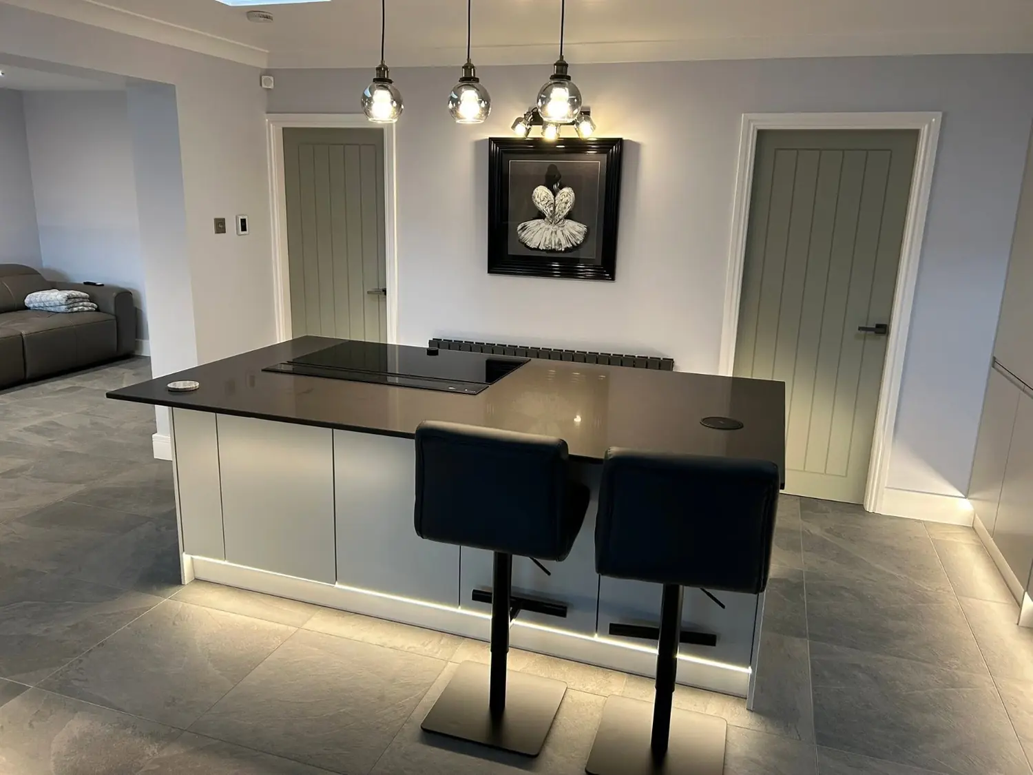 Handleless kitchen island with quartz worktop and induction hob, Blackpool