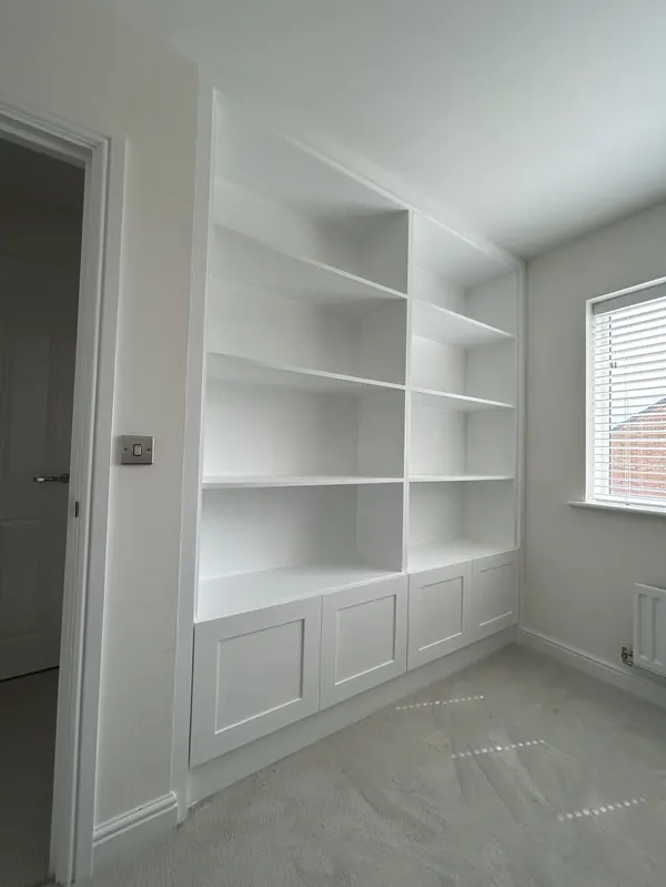 Bespoke media wall with integrated shelving, LED lighting and electric fire fitted in Blackpool